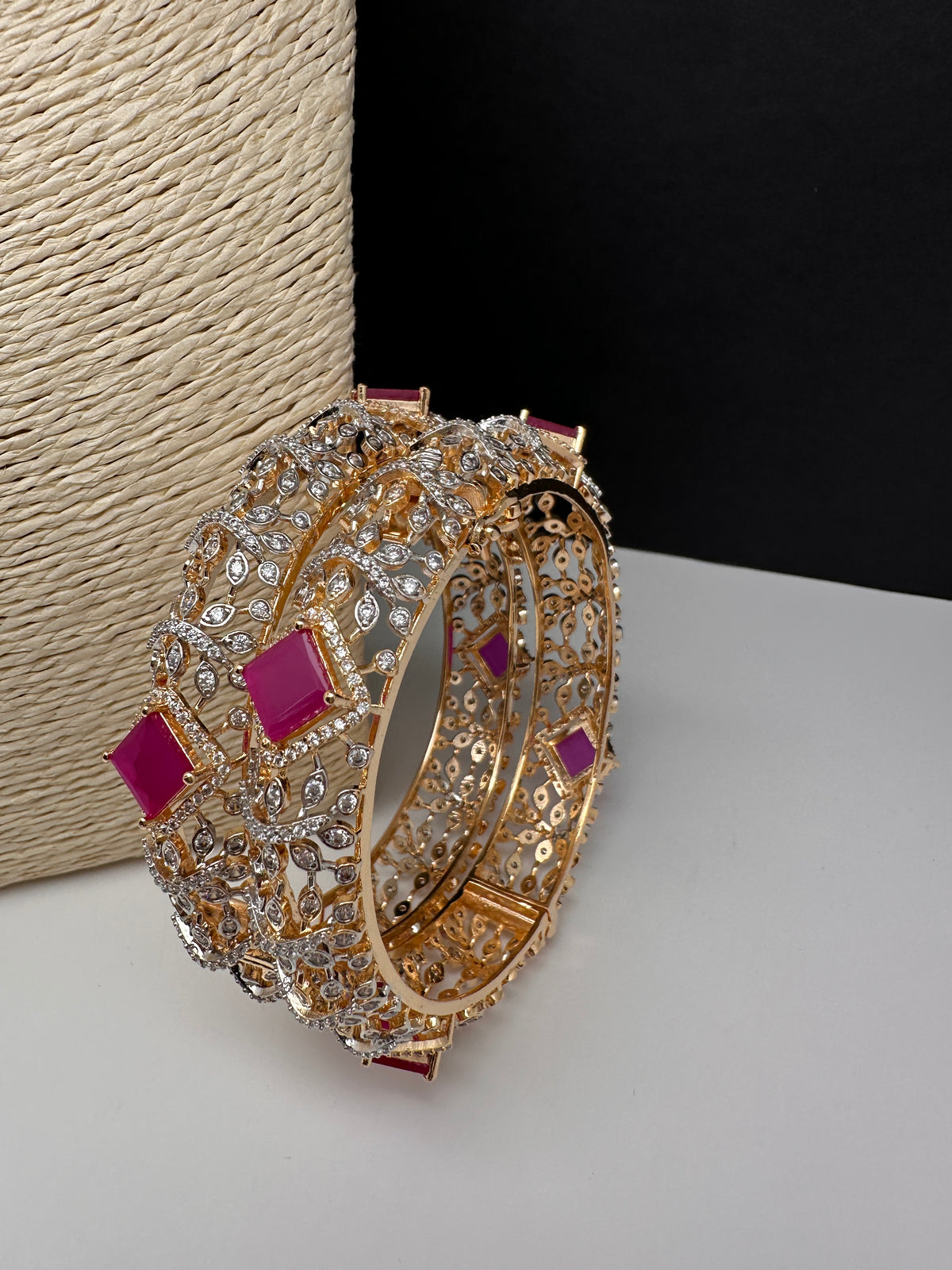 Diamond finish ruby AD bangles with red stones in gold finish