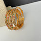 Set of 4 Sleek Goddess Lakshmi Bangles in CZ Red and Green Stones - 2.8