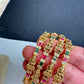 Set of 4 Sleek Goddess Lakshmi Bangles in CZ Red and Green Stones - 2.8