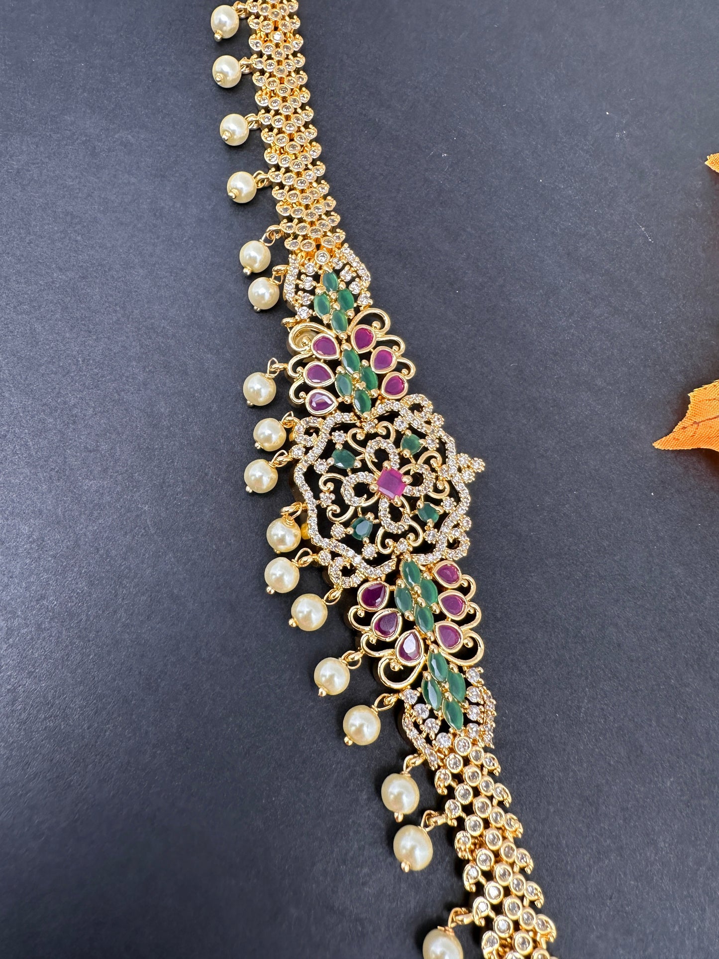 Sleek CZ Red Green Multi Stone Hip Chain Vaddanam