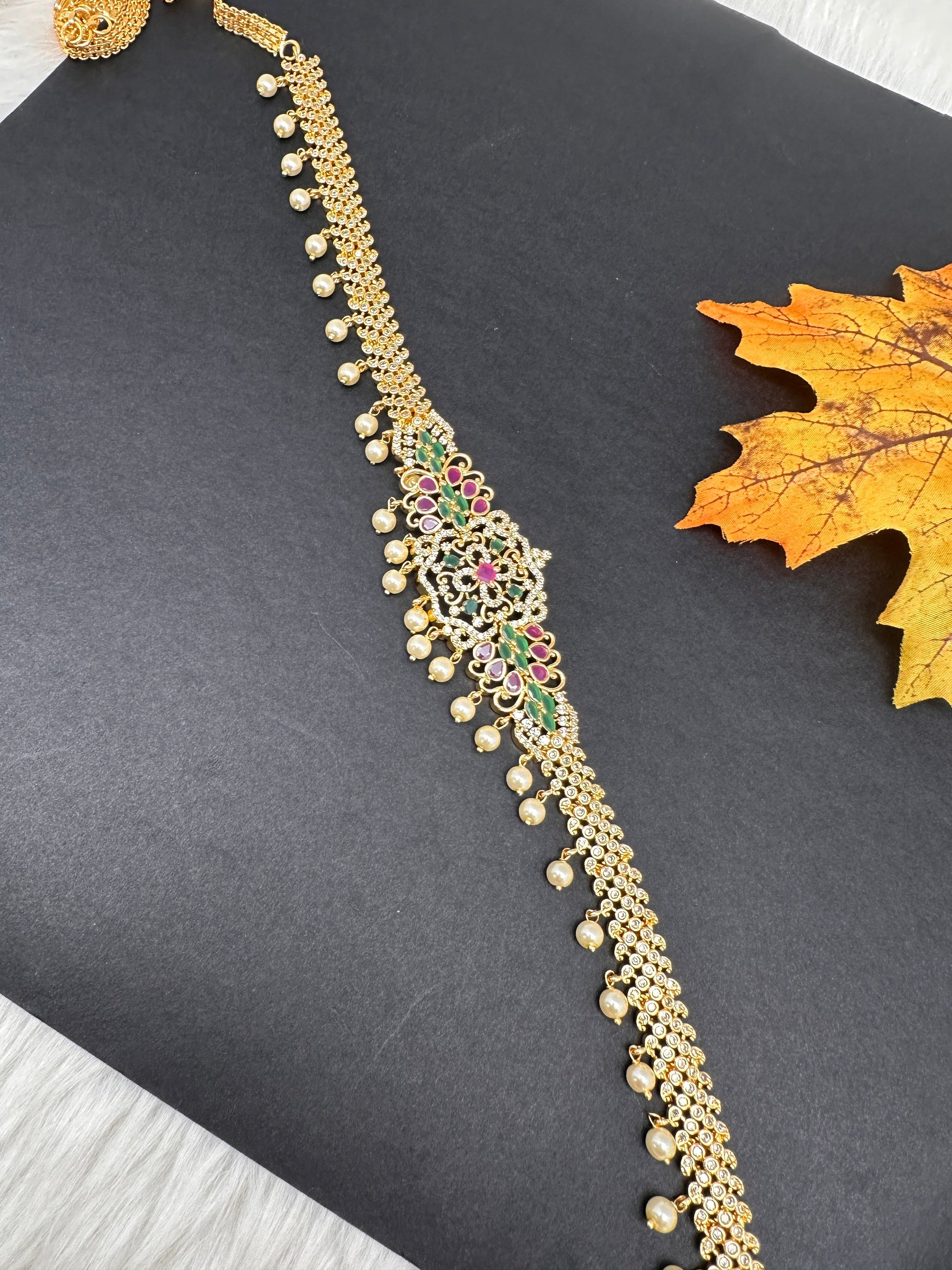 Sleek CZ Red Green Multi Stone Hip Chain Vaddanam