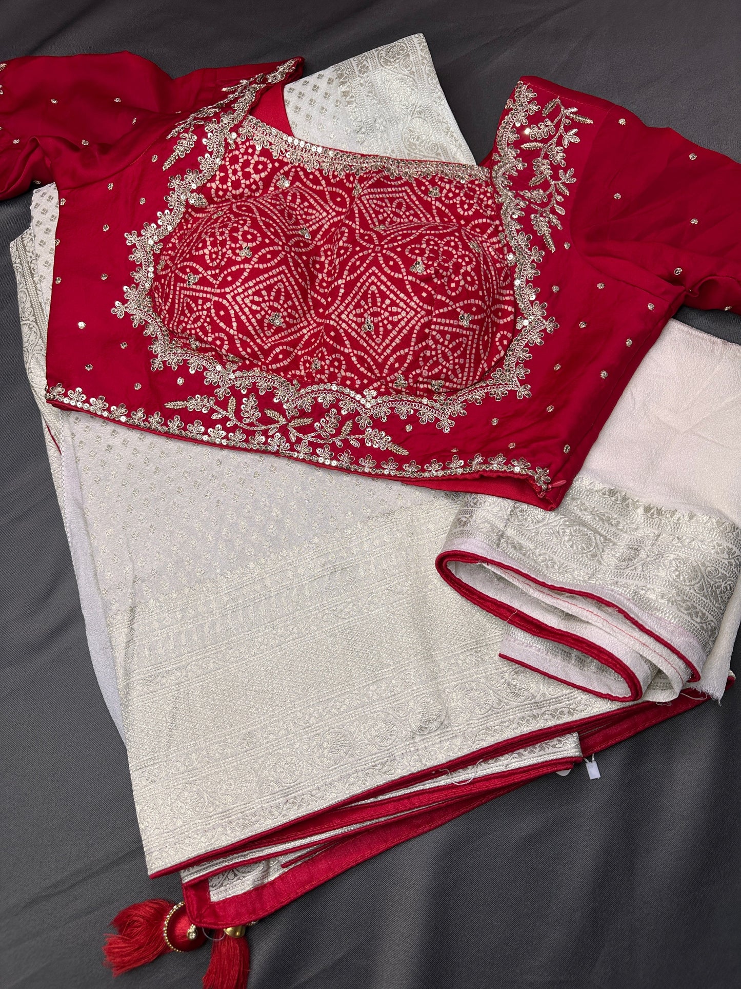 White Saree with Red Saree and a blouse piece