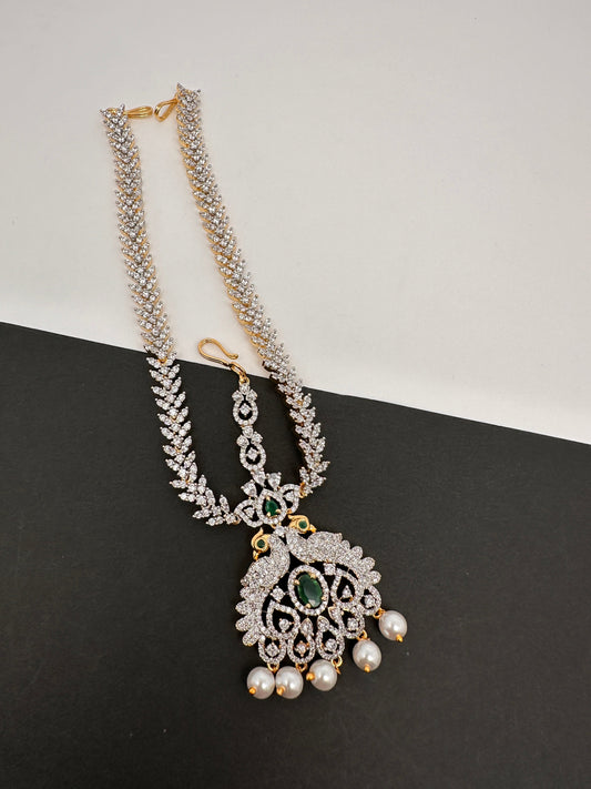 Diamond FinishPeacock Maangteeka Mathapatti with Red Stone