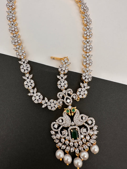 Diamond FinishPeacock Maangteeka Mathapatti with Red Stone