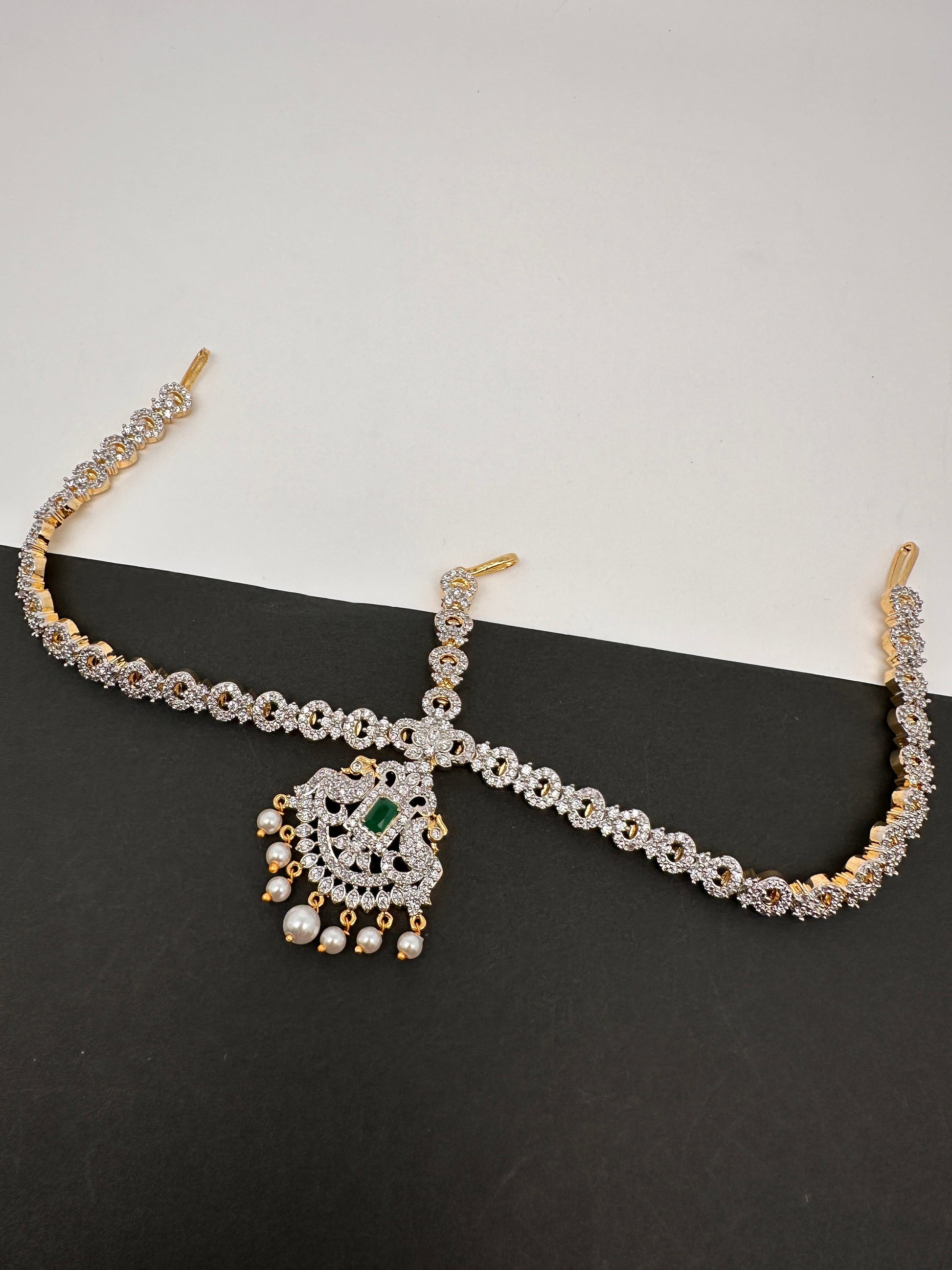 Diamond FinishPeacock Maangteeka Mathapatti with Red Stone