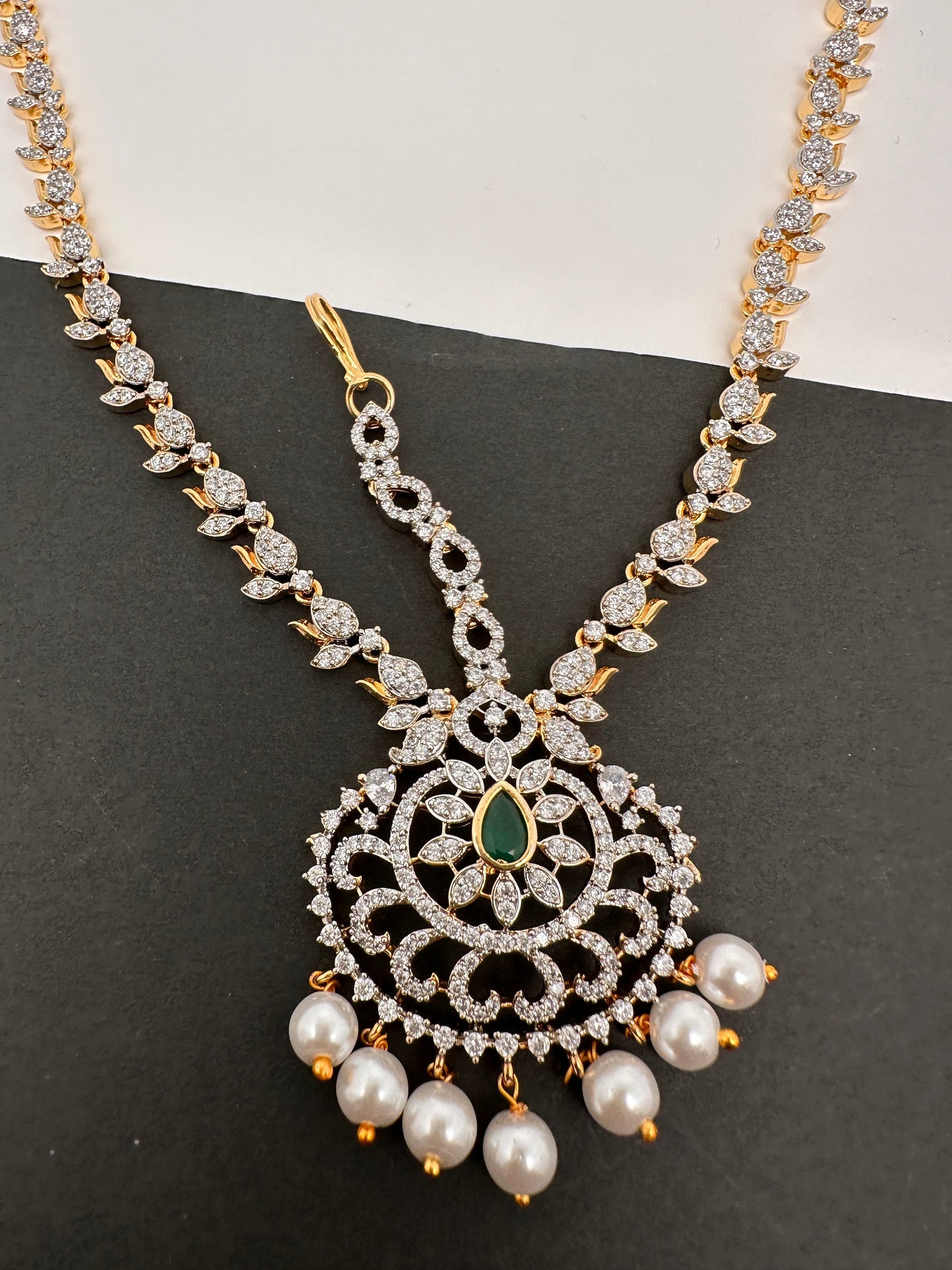 Diamond FinishPeacock Maangteeka Mathapatti with Red Stone