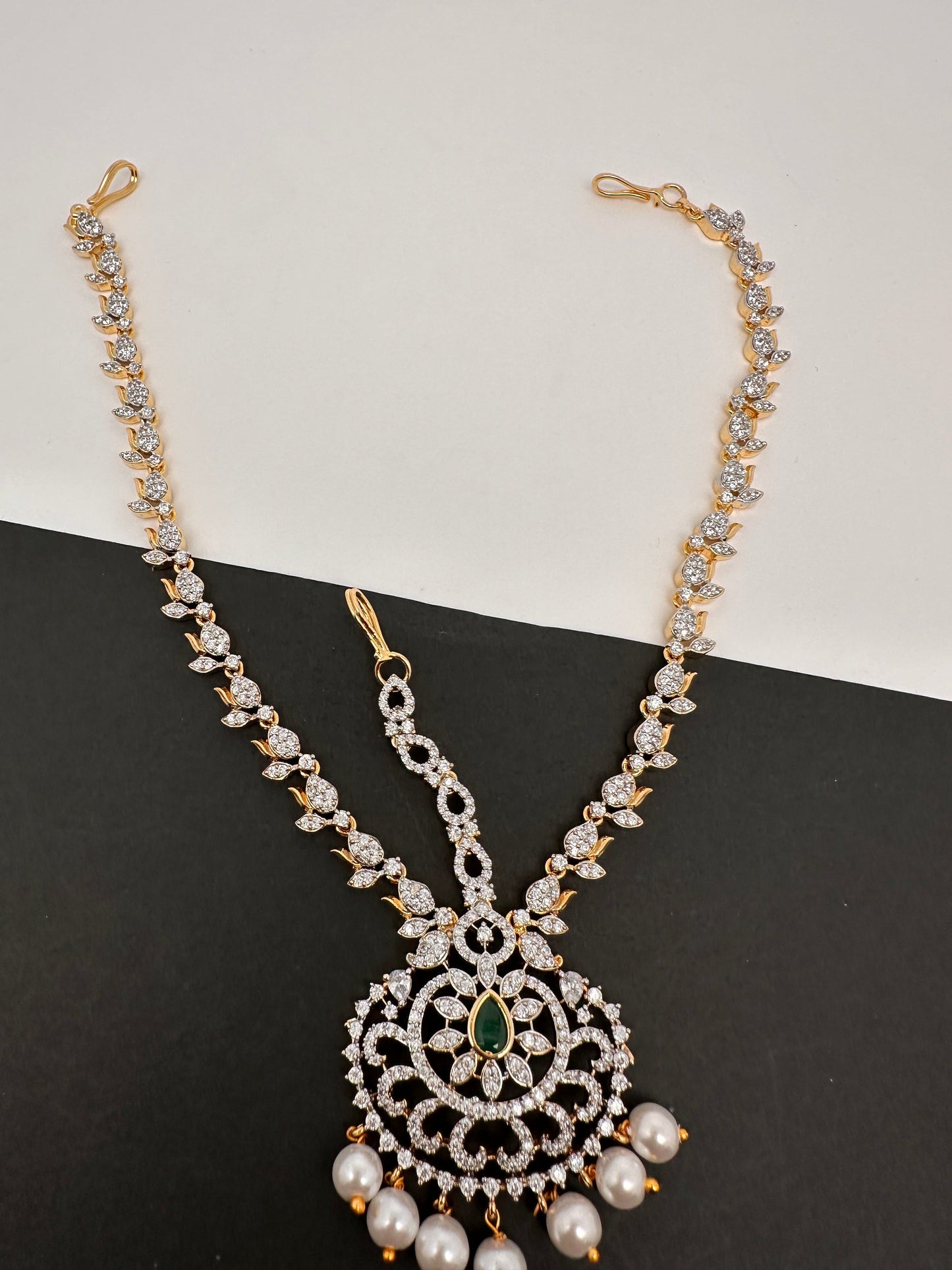 Diamond FinishPeacock Maangteeka Mathapatti with Red Stone