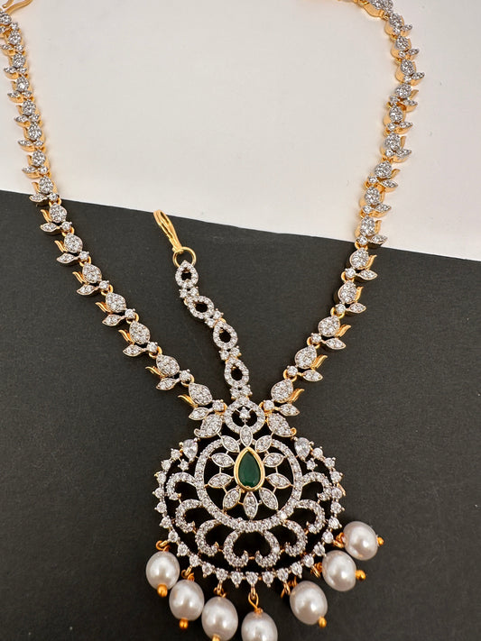 Diamond FinishPeacock Maangteeka Mathapatti with Red Stone